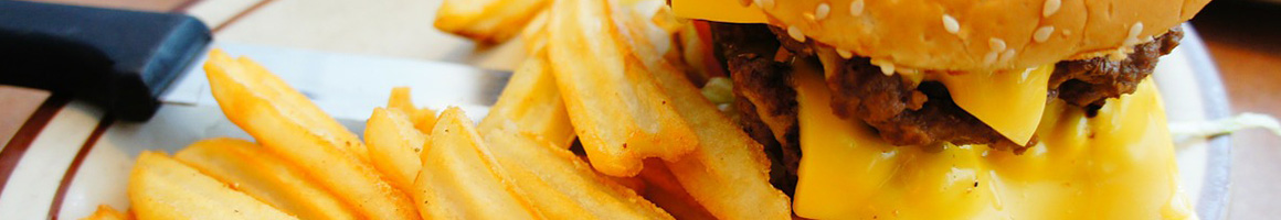 Eating Burger at Tom's #1 World Famous Chiliburgers restaurant in Redlands, CA.